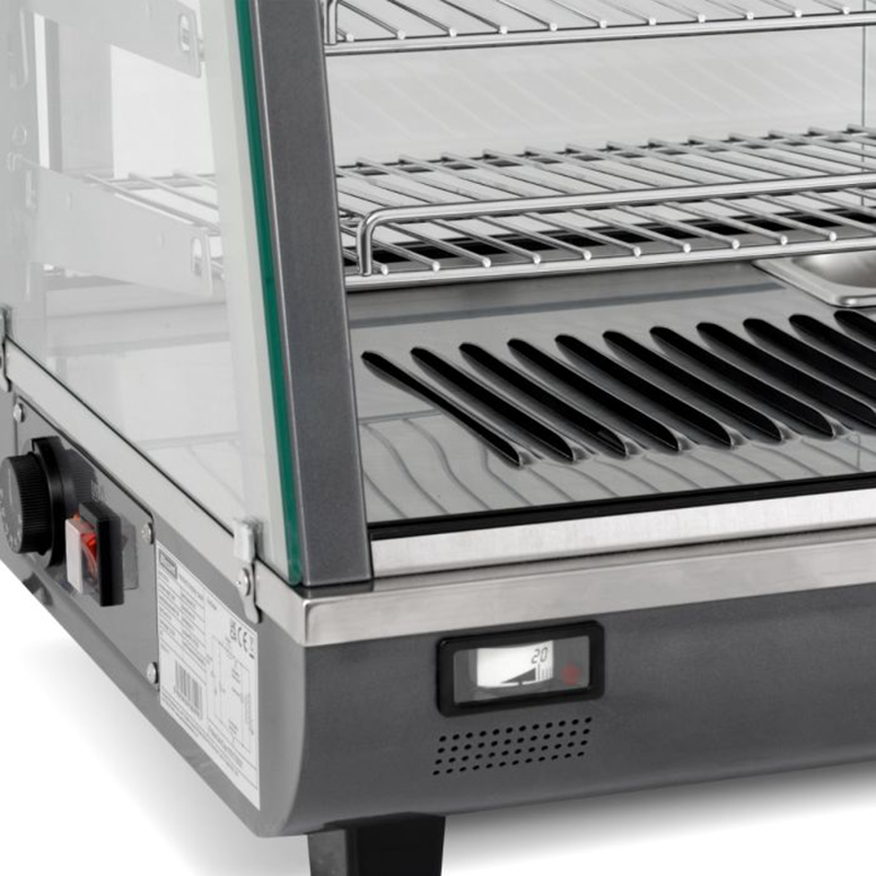 Blizzard HSS136 136L Counter Top Duel Access Heated Merchandiser, Angled Close Up View Of The Chrome Shelving, Humidity Pan and Bottom Left Edge Of The Appliance