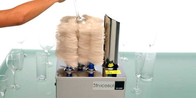Frucosol SV1000 Glass Polisher being used by a person to polish a glass.
