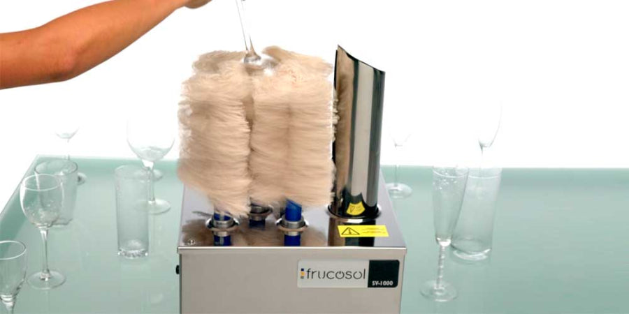 Frucosol SV1000 Glass Polisher being used by a person to polish a glass.