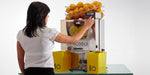 Person operating the Frucosol F50C Juicer.
