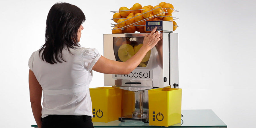 Person operating the Frucosol F50C Juicer.